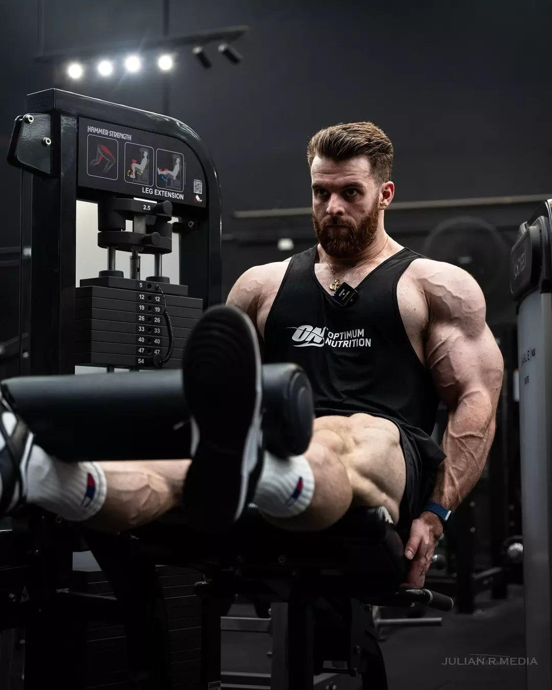 Jaxon on leg press machine in gym