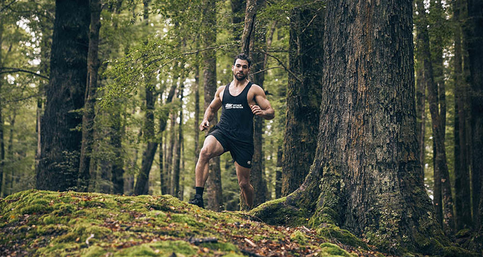 Guy running in woods