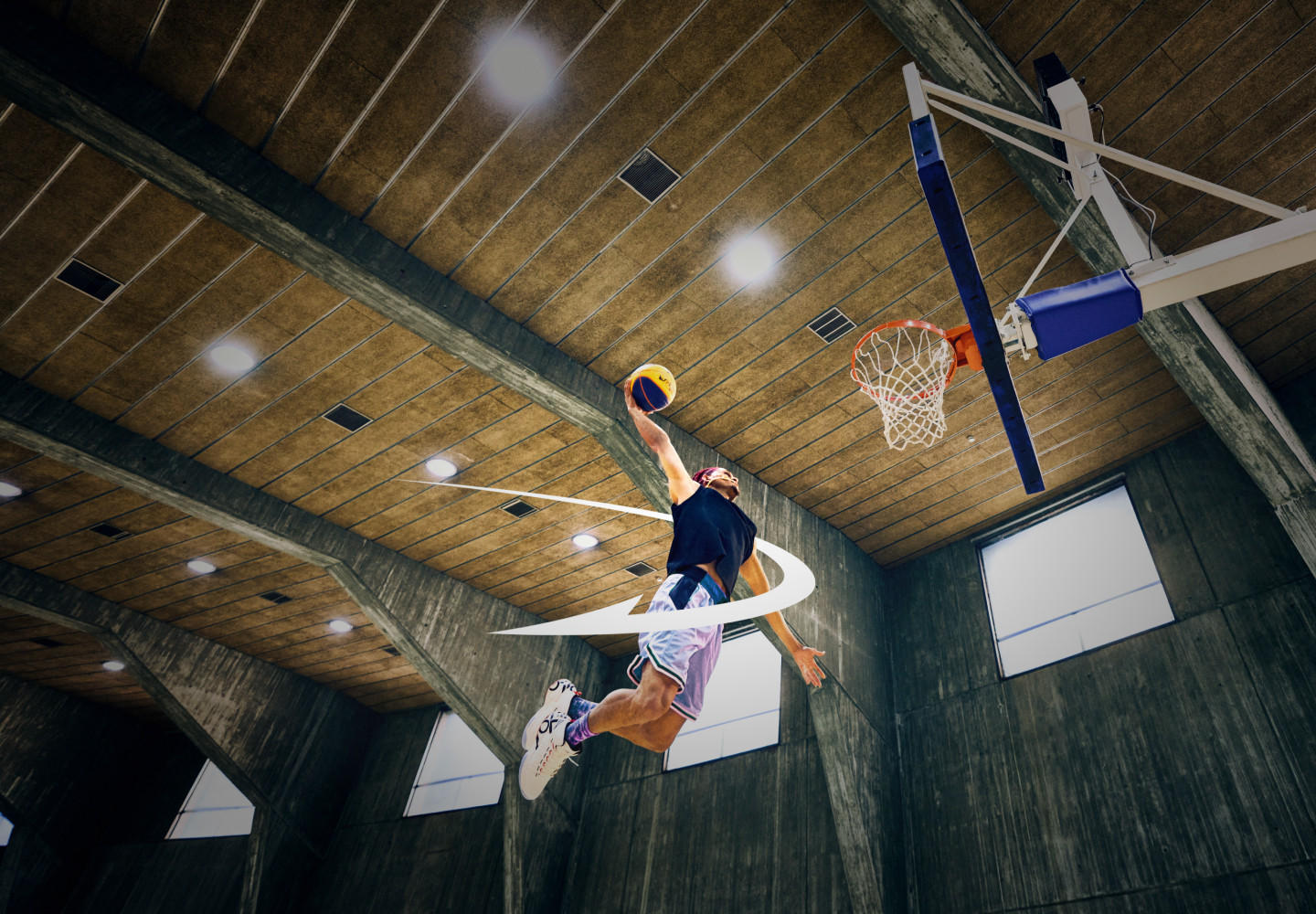 man about to dunk basketball into hoop with ON orbit around body